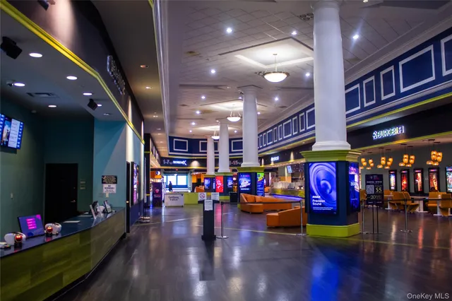 a building with lots of cars parked in front of it