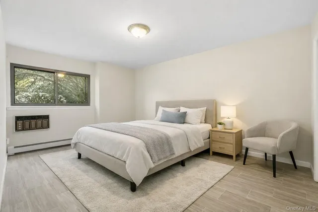 a bed room with a bed and a chair