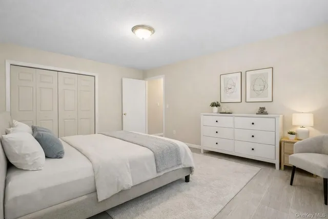 a bedroom with a bed and a dresser