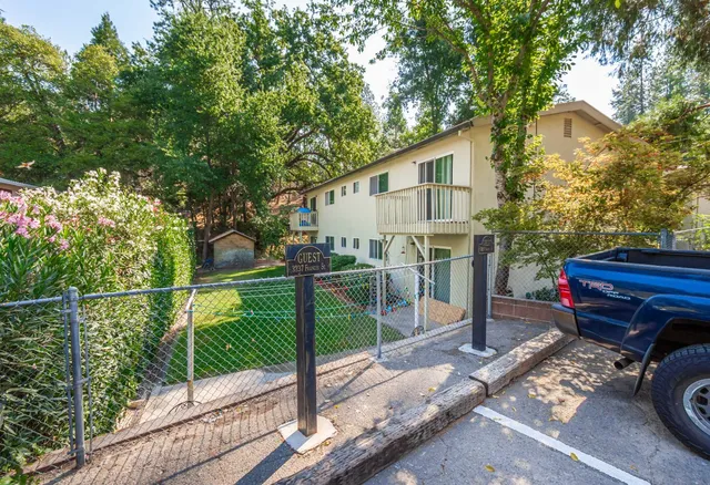 a view of a house and a yard