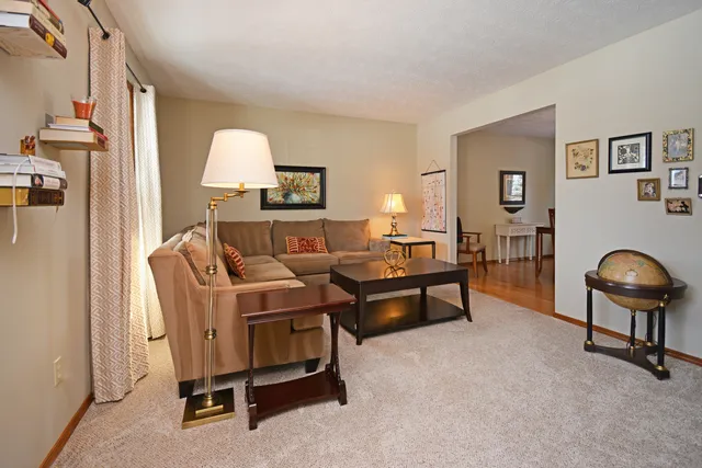 a dining room with furniture and window