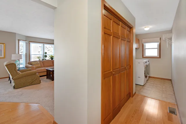 a bedroom with furniture and wooden floor
