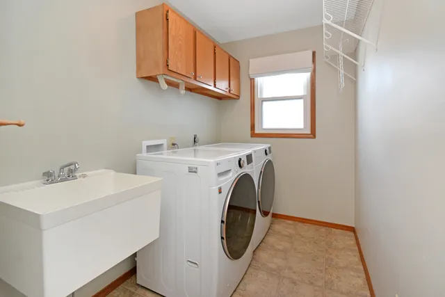 a bedroom with a bed and a large window with the outer view