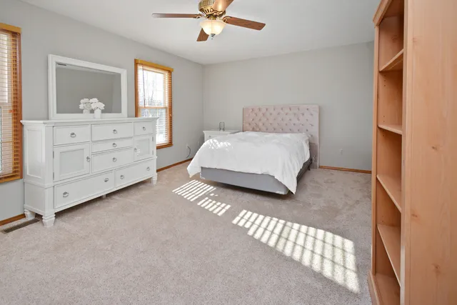 a living room with dining table and a wooden floor