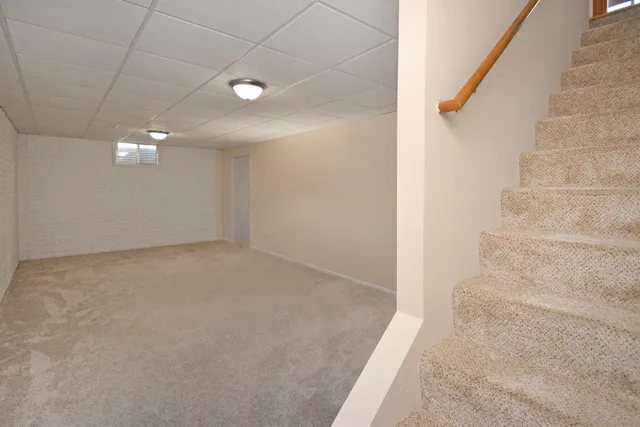 a view of a building with a snow in the background