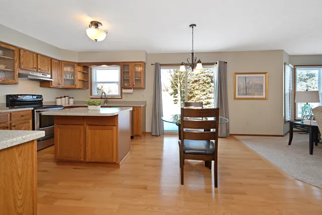a living room with fireplace furniture and a wooden floor