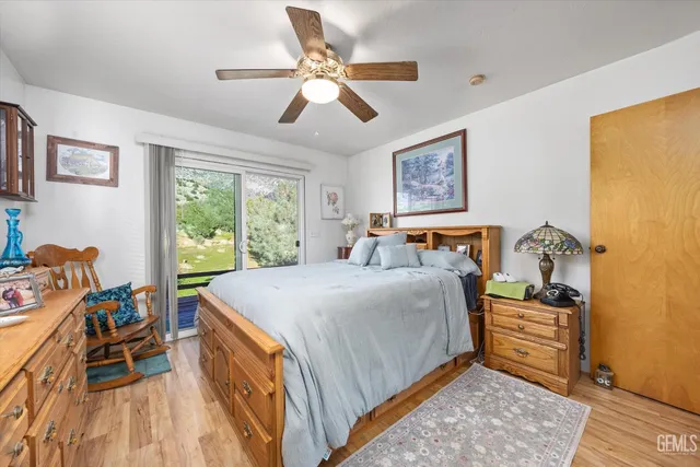 a bedroom with a bed and a table in it