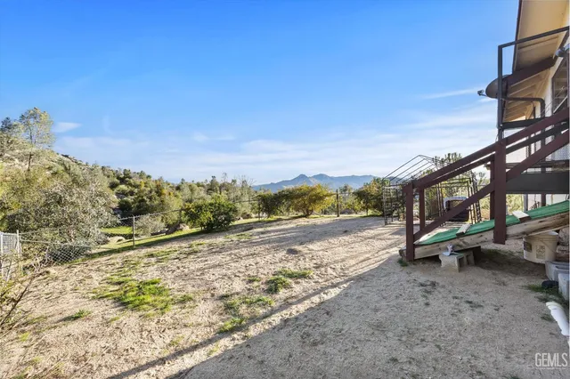 a view of a yard with car parked