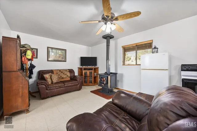 a kitchen with stainless steel appliances granite countertop a refrigerator sink and cabinets