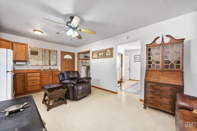 a bedroom with a bed and a dresser in it