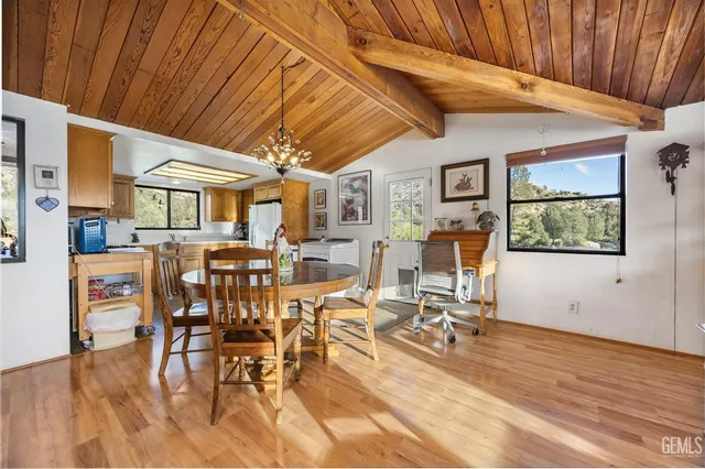 a view of a dining hall with furniture and wooden floor