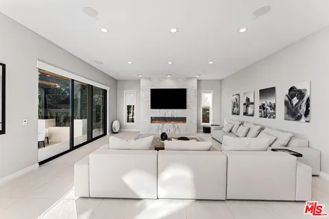 a bathroom with a double vanity sink mirror and shower