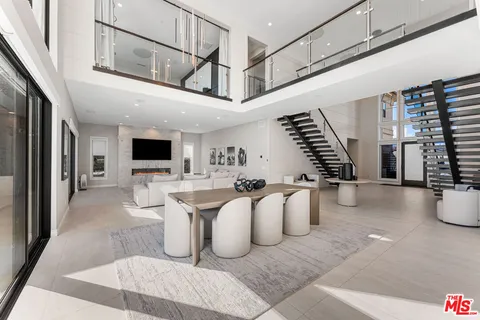 a kitchen with stainless steel appliances granite countertop a sink and stove