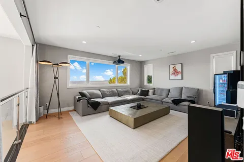 a kitchen with a dining table chairs sink and stove