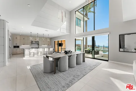 a large kitchen with stainless steel appliances granite countertop a lot of counter space and wooden floor