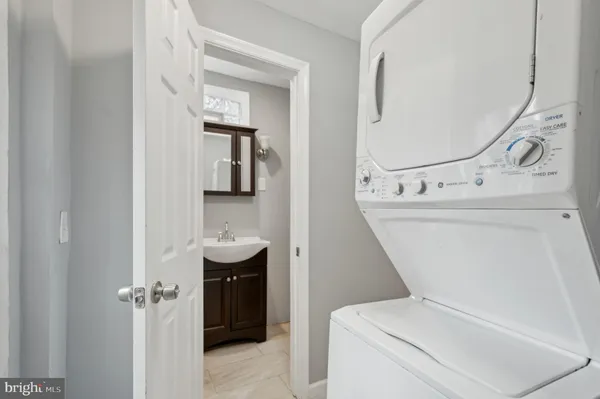 a bathroom with a sink a mirror and shower