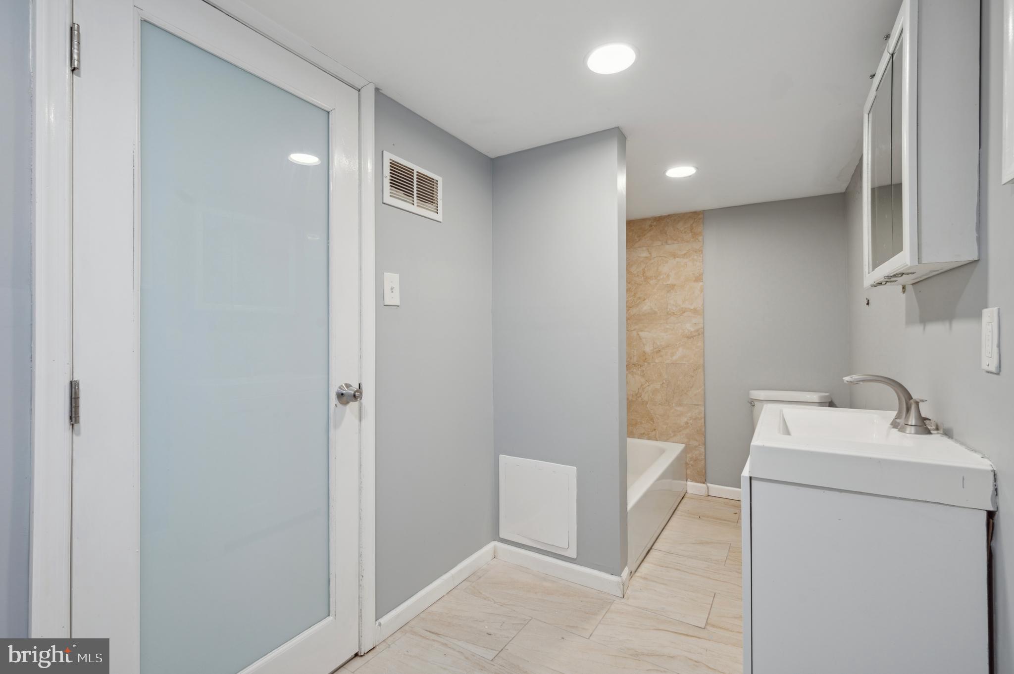 3236 West Berks Street Philadelphia, PA 19121 - Photo 21 of 35 a bathroom with a sink a toilet and shower