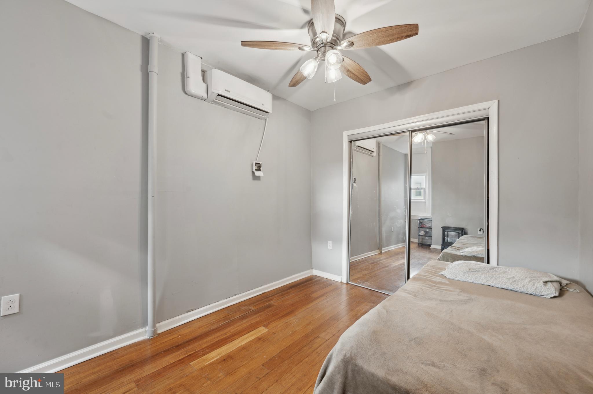 3236 West Berks Street Philadelphia, PA 19121 - Photo 34 of 35 a bedroom with a bed and a chandelier