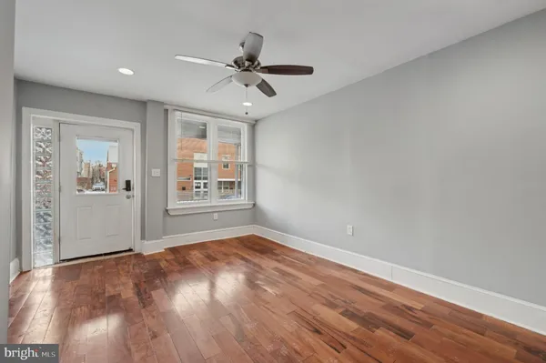 a view of livingroom with hardwood floor and ceiling fan