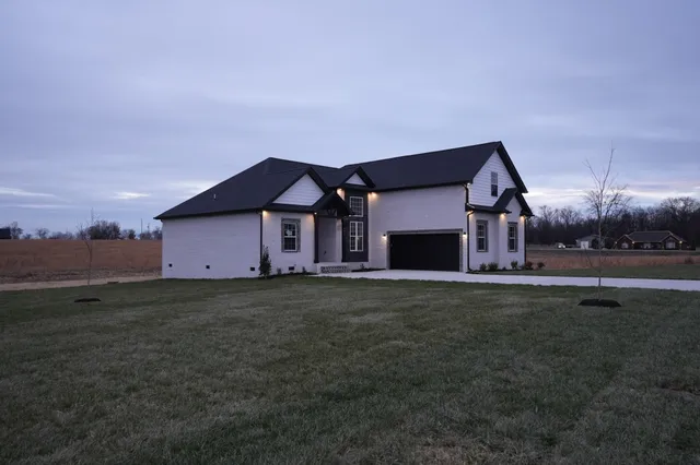a front view of a house with a yard