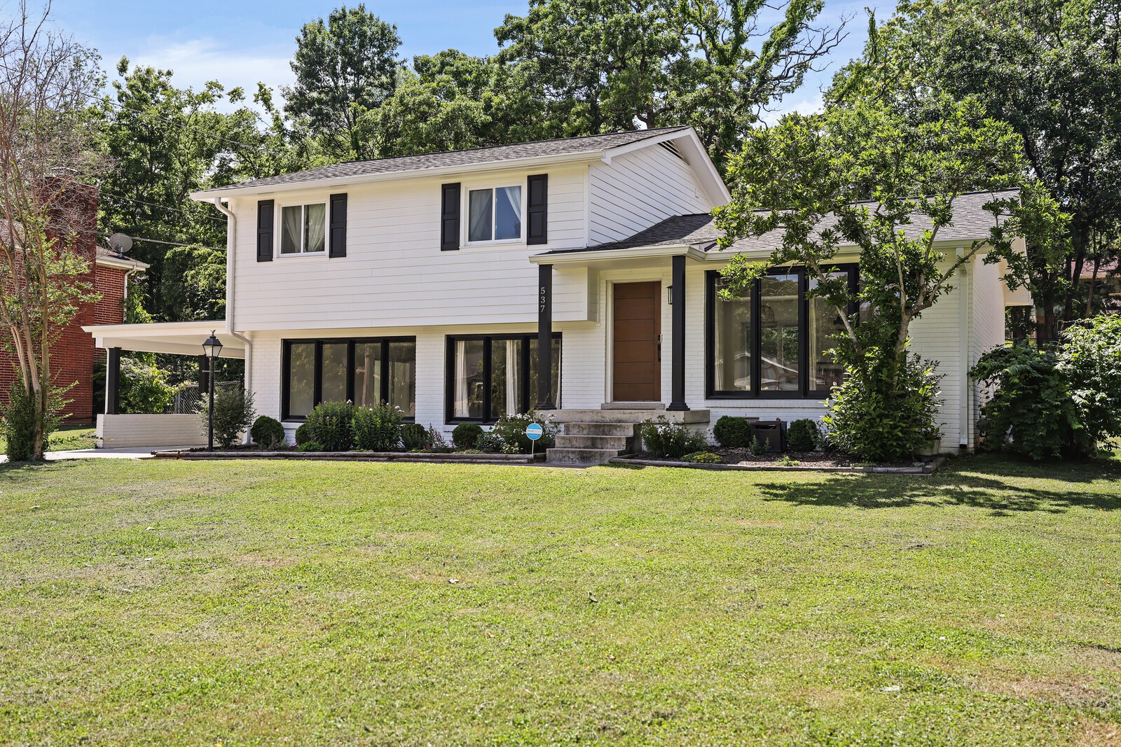 537 Rural Hill Road Nashville, TN 37217 - Photo 2 of 37 a front view of a house with a garden