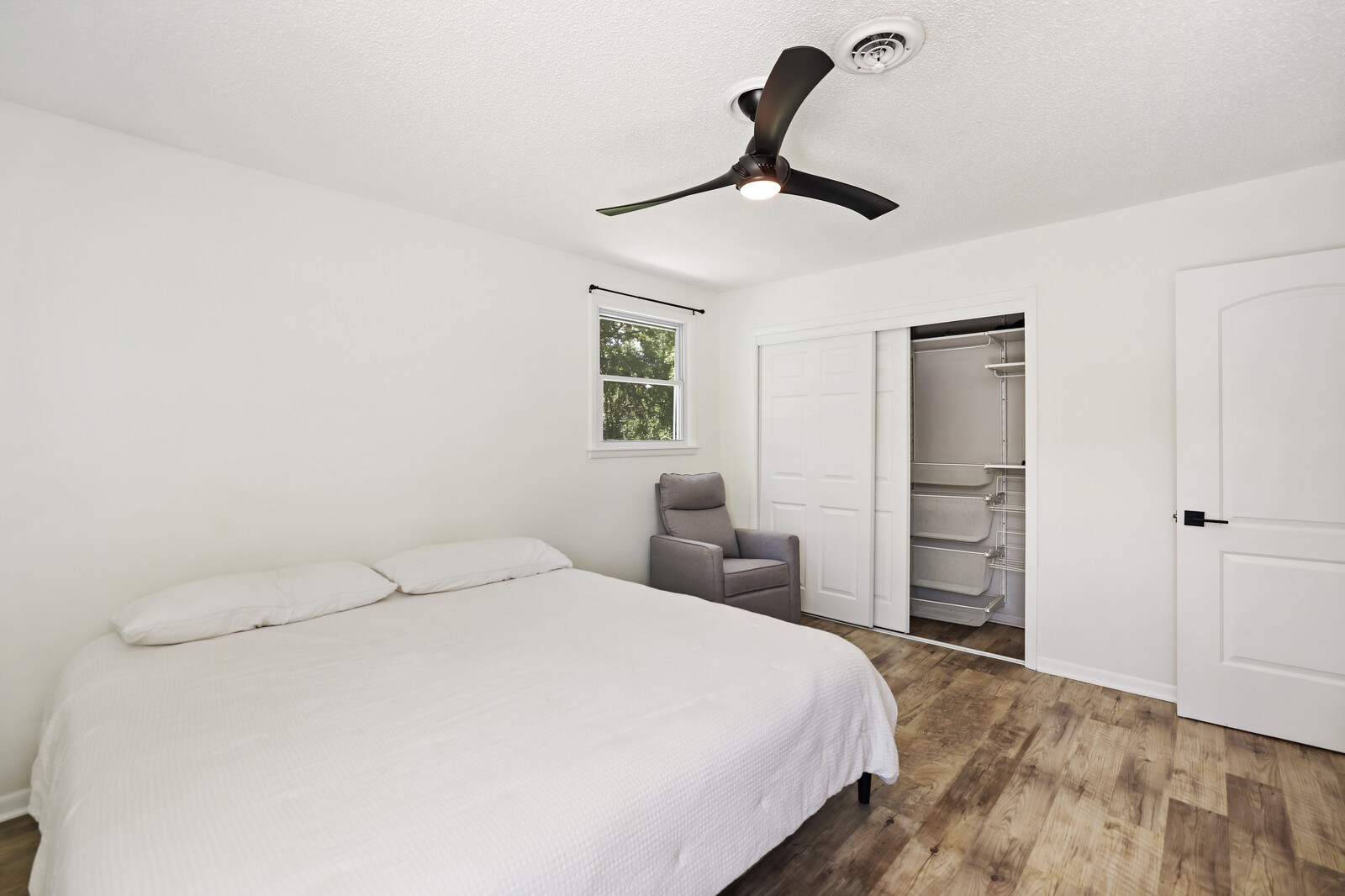 537 Rural Hill Road Nashville, TN 37217 - Photo 23 of 37 a bedroom with a bed and a chandelier