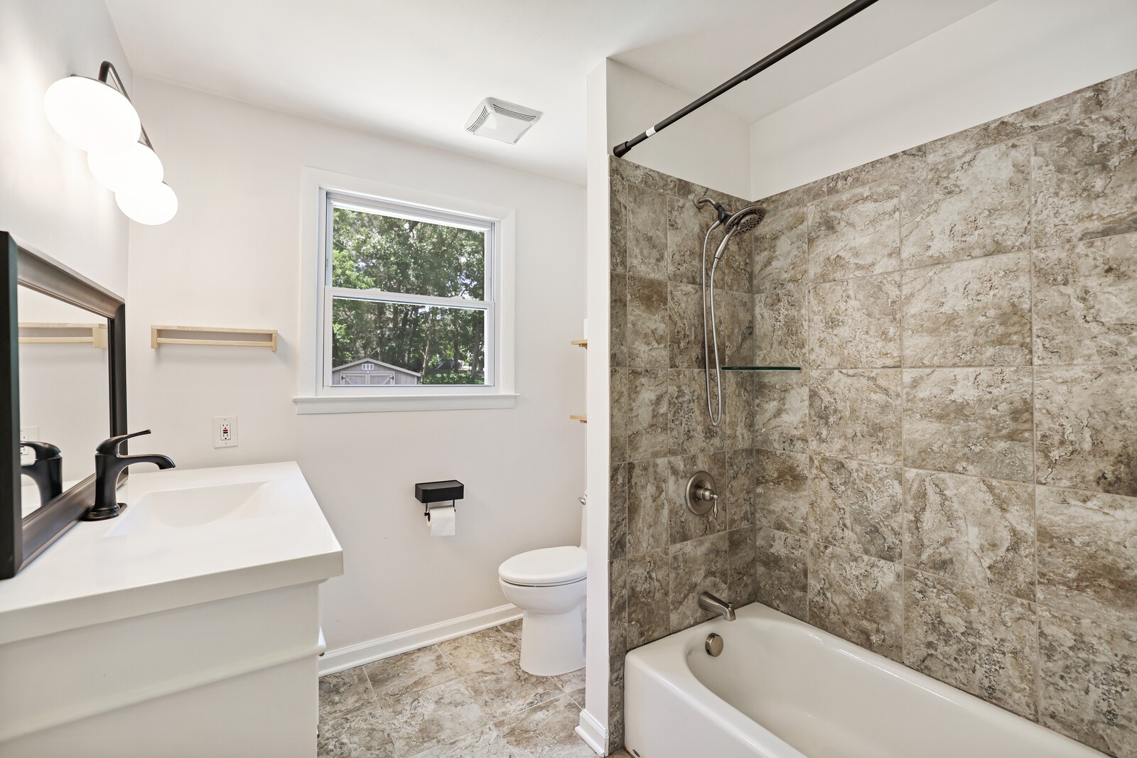 537 Rural Hill Road Nashville, TN 37217 - Photo 24 of 37 a bathroom with a sink a toilet a mirror a bathtub and shower