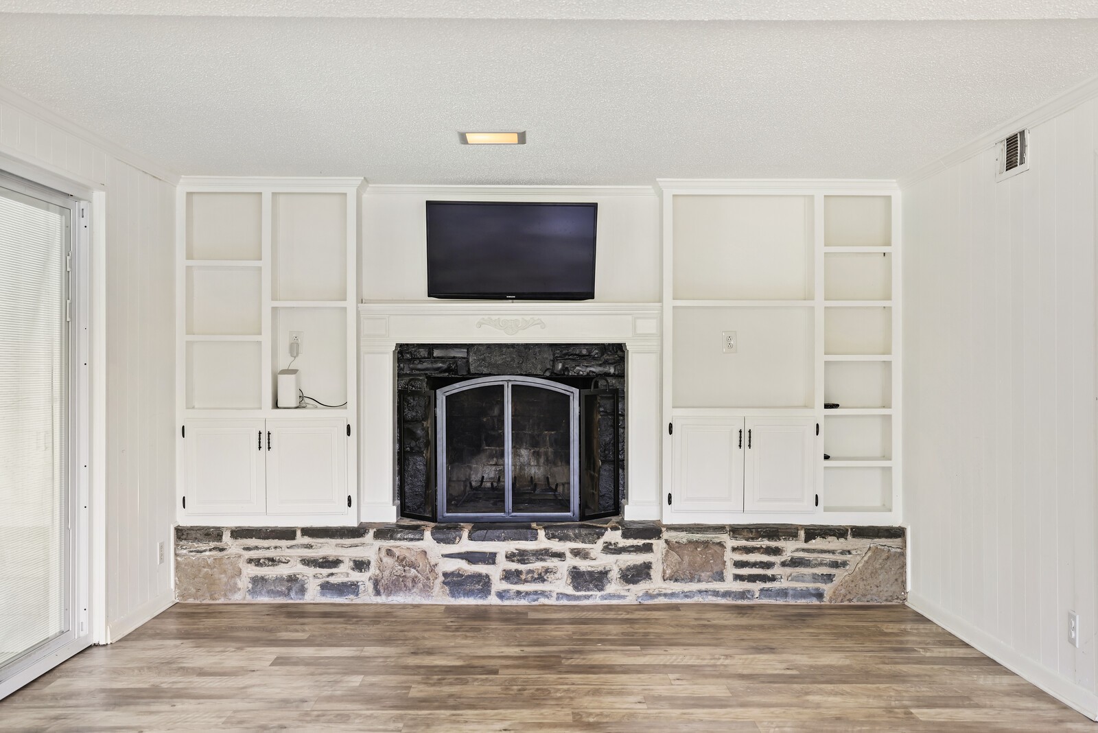 537 Rural Hill Road Nashville, TN 37217 - Photo 32 of 37 a living room with furniture a flat screen tv and a fireplace