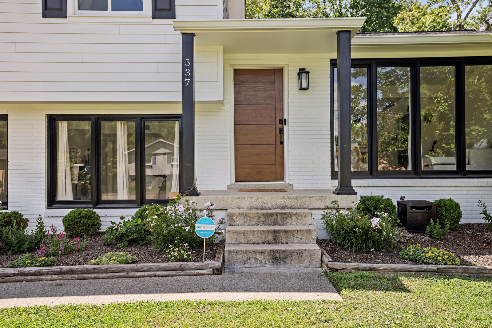 537 Rural Hill Road Nashville, TN 37217 - Photo 5 of 37 a front view of a house with a garden and plants