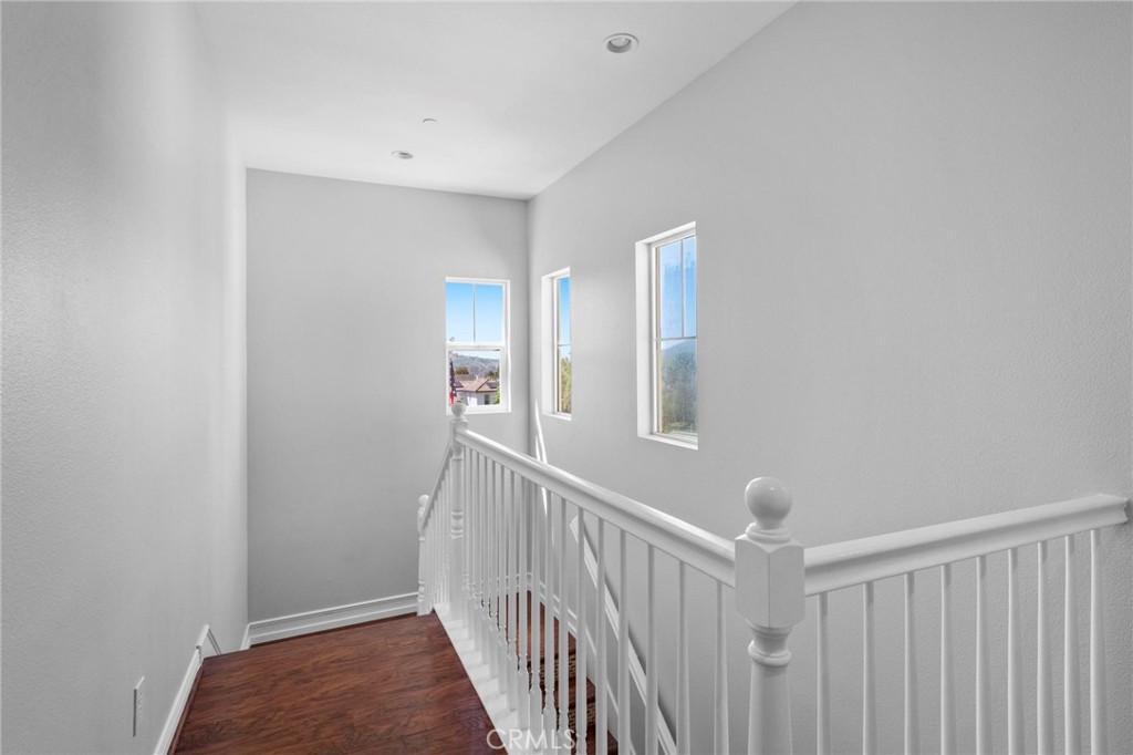47 Bedstraw Loop Ladera Ranch, CA 92694 - Photo 16 of 44 a view of a hallway with windows