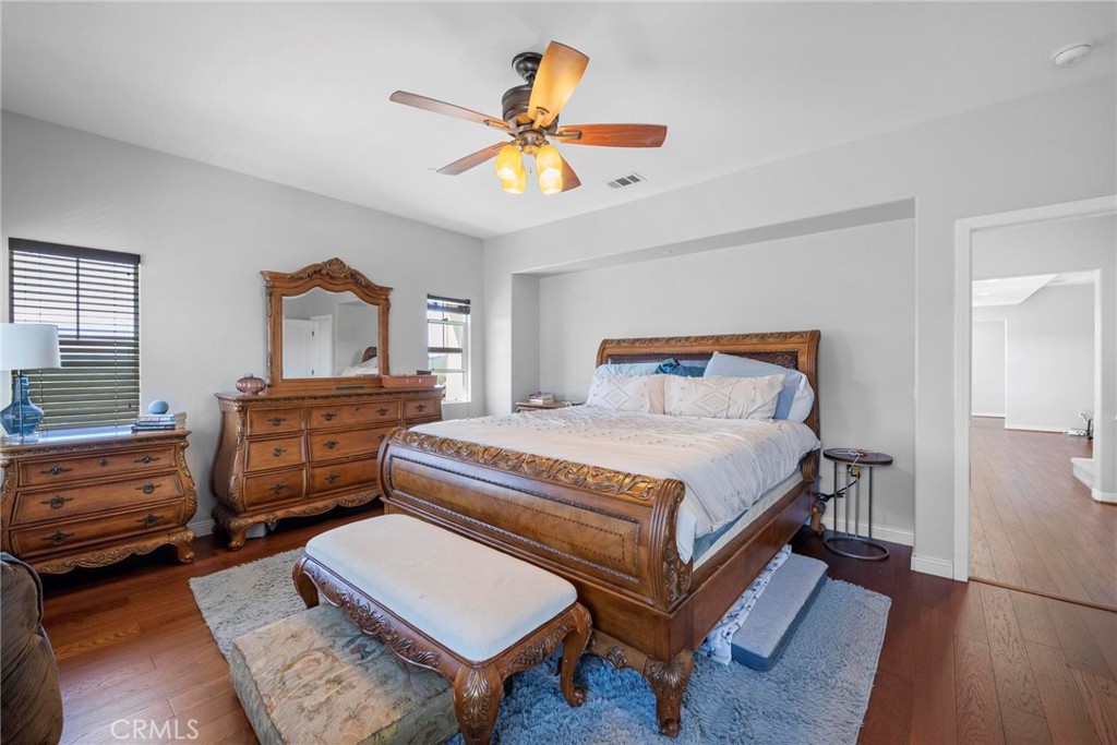 47 Bedstraw Loop Ladera Ranch, CA 92694 - Photo 19 of 44 a bedroom with a bed and a chandelier