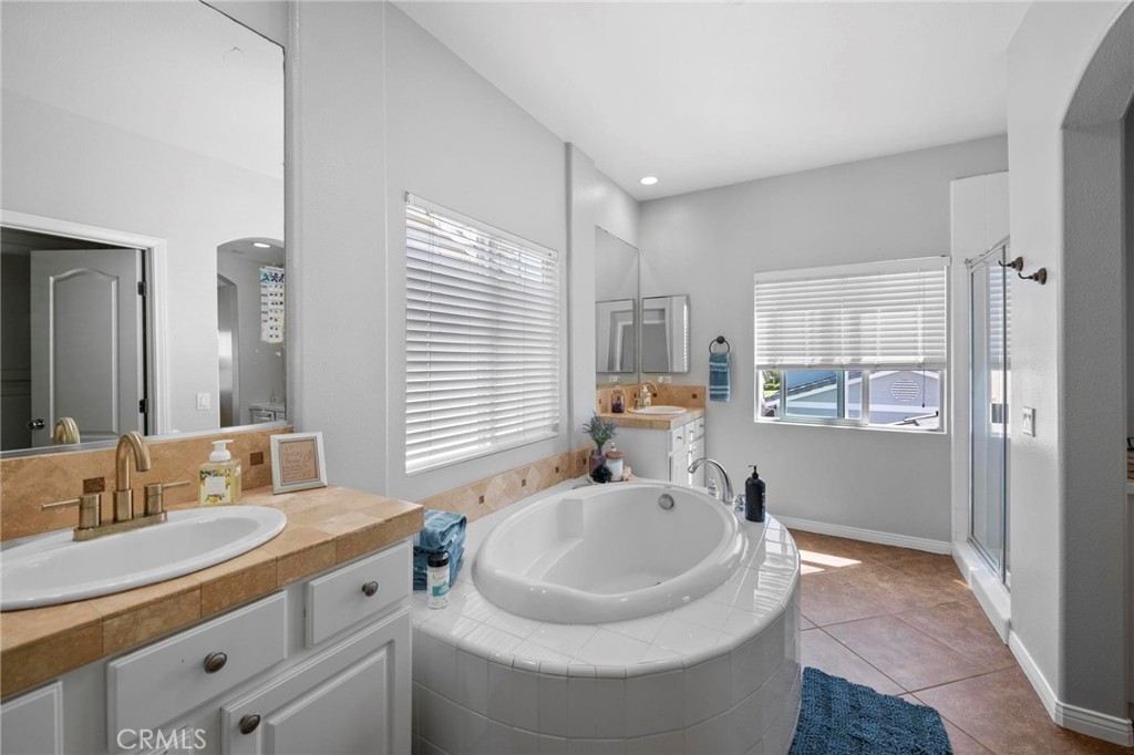 47 Bedstraw Loop Ladera Ranch, CA 92694 - Photo 20 of 44 a bathroom with a sink and a mirror