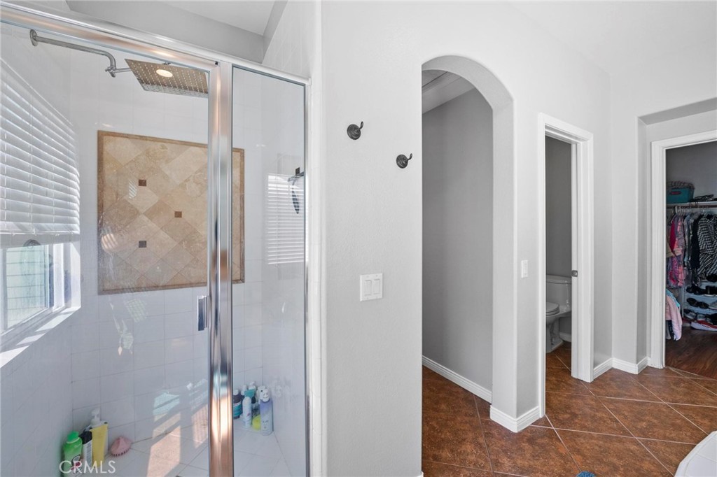 47 Bedstraw Loop Ladera Ranch, CA 92694 - Photo 21 of 44 a bathroom with a shower and a glass door
