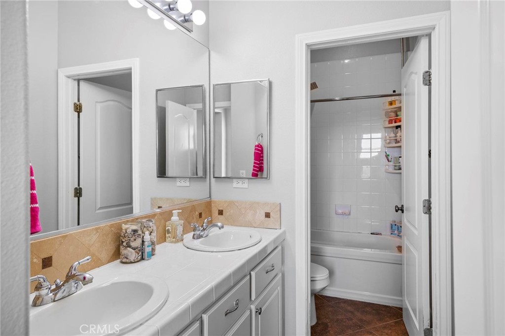 47 Bedstraw Loop Ladera Ranch, CA 92694 - Photo 25 of 44 a bathroom with a tub sink and mirror