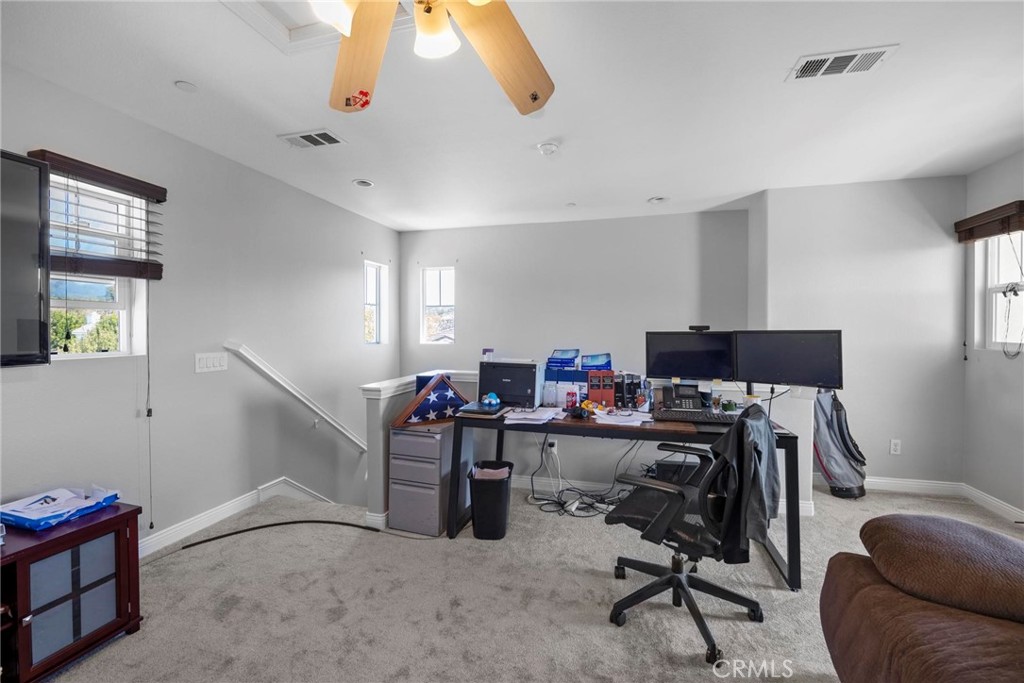47 Bedstraw Loop Ladera Ranch, CA 92694 - Photo 30 of 44 a view of a workspace with furniture and a window