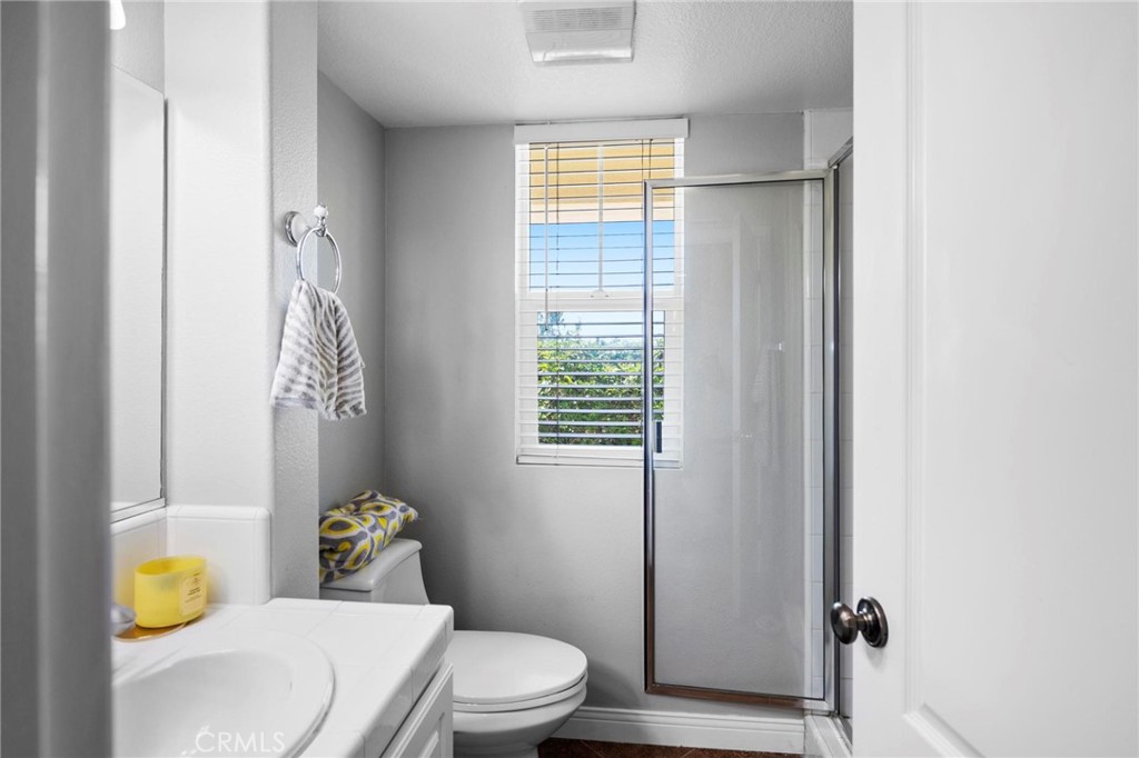 47 Bedstraw Loop Ladera Ranch, CA 92694 - Photo 32 of 44 a white toilet sitting next to a bathroom sink