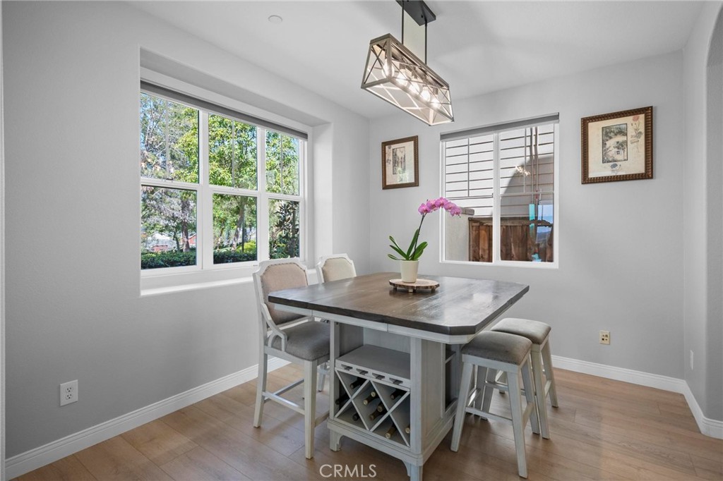 47 Bedstraw Loop Ladera Ranch, CA 92694 - Photo 4 of 44 a view of a dining room with furniture window and wooden floor