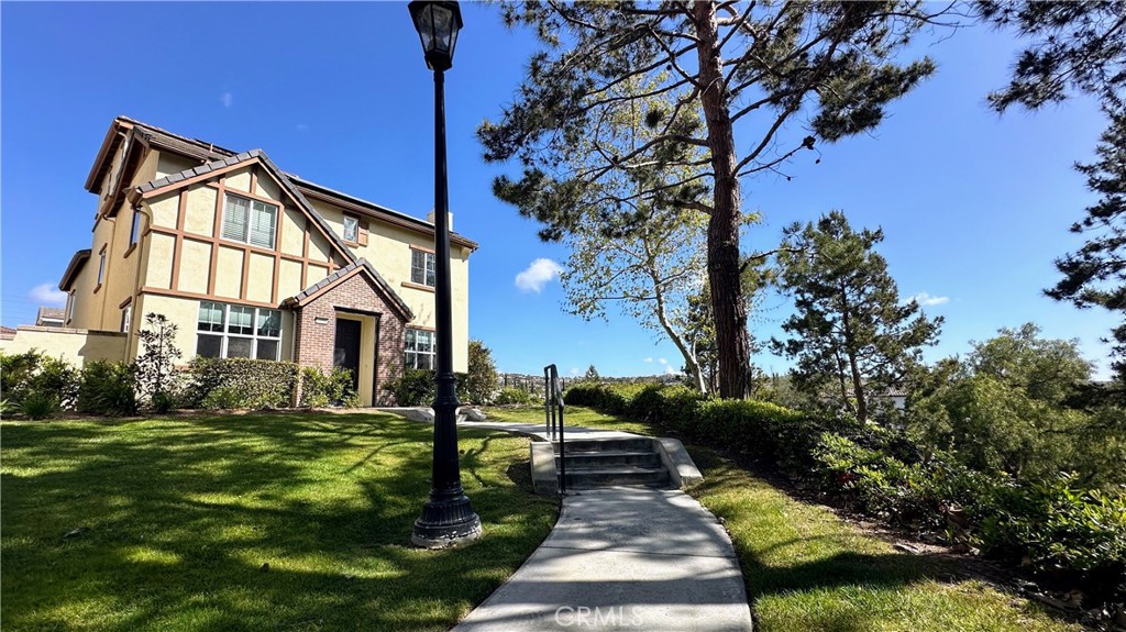 47 Bedstraw Loop Ladera Ranch, CA 92694 - Photo 43 of 44 a front view of a house with a yard