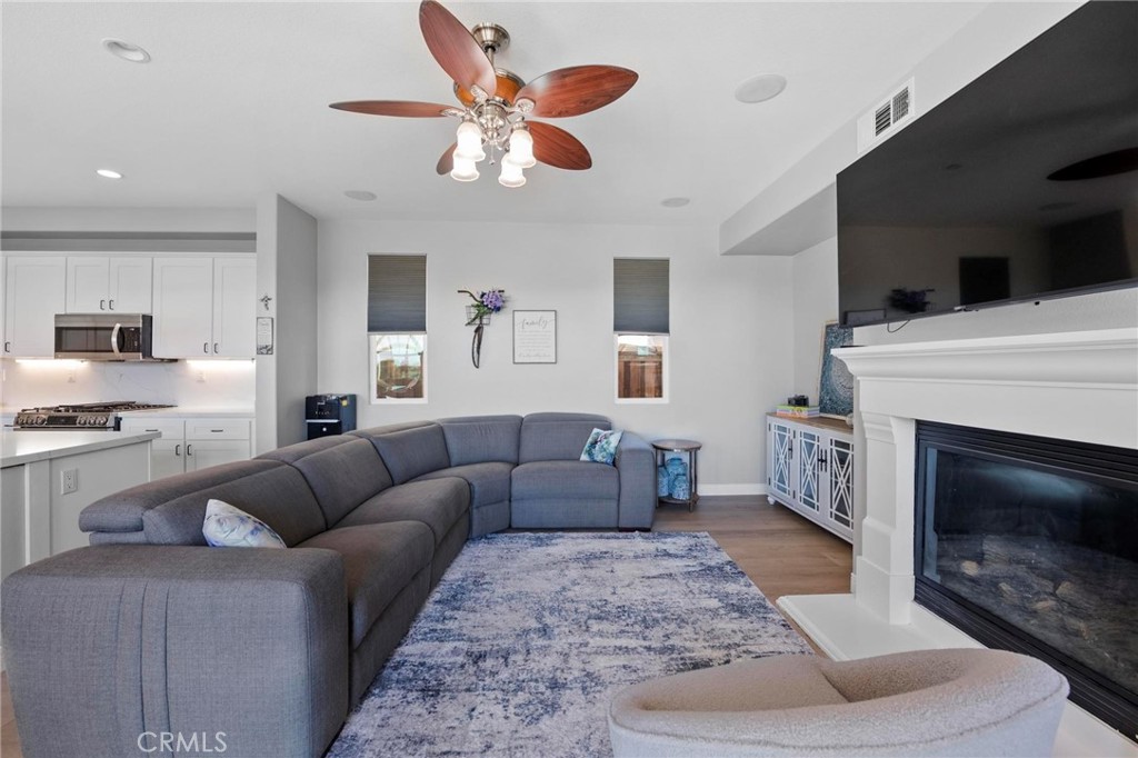 47 Bedstraw Loop Ladera Ranch, CA 92694 - Photo 9 of 44 a living room with furniture and a fireplace
