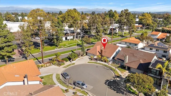 an aerial view of a house with a swimming pool