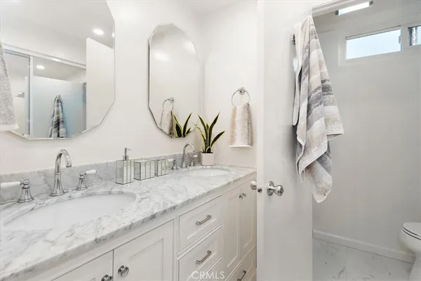a living room with a couch and a stove top oven