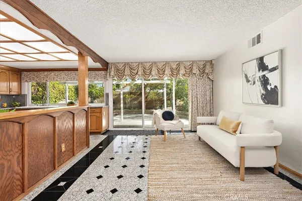a living room with furniture and a rug