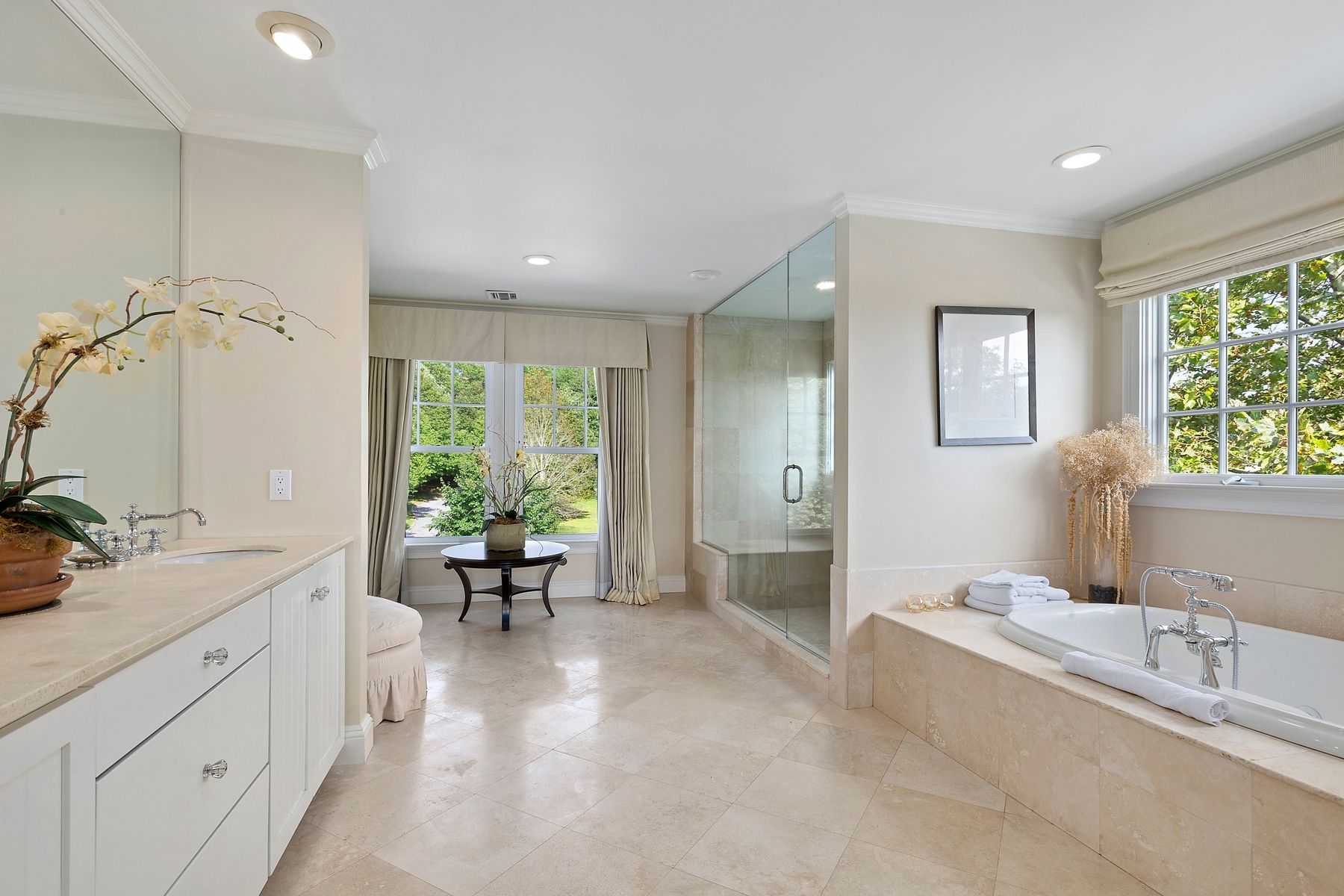 920 Old Sag Harbor Road Water Mill, NY 11976 - Photo 14 of 19 a spacious bathroom with a double vanity sink a mirror and a bathtub