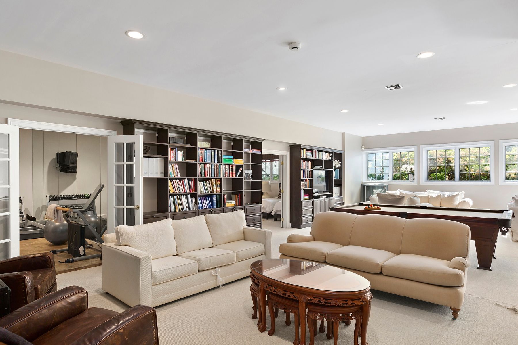 920 Old Sag Harbor Road Water Mill, NY 11976 - Photo 17 of 19 a living room with furniture and a large window