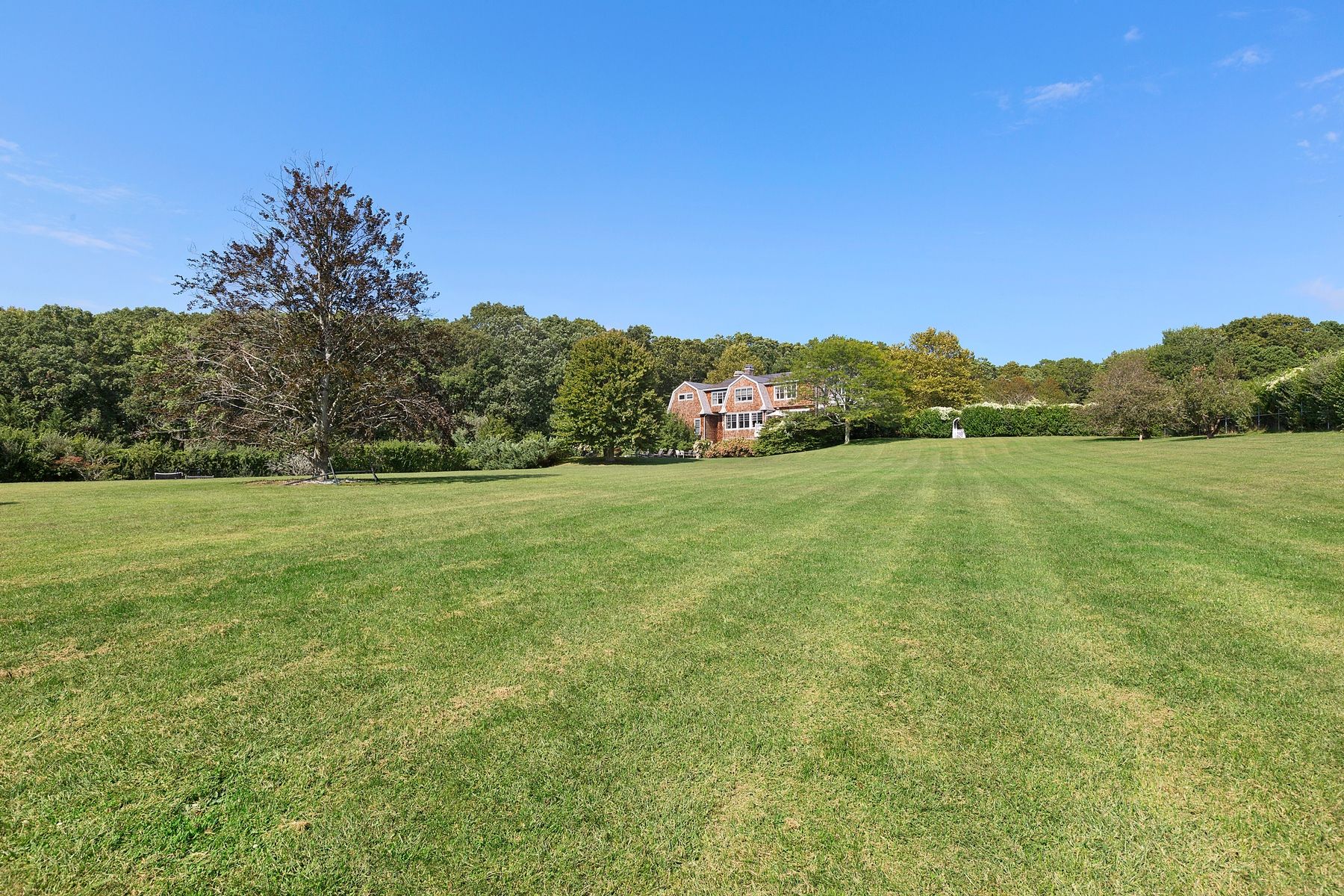 920 Old Sag Harbor Road Water Mill, NY 11976 - Photo 5 of 19 a view of a field with an ocean