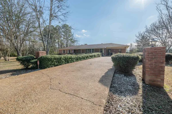 a view of a backyard with sitting area