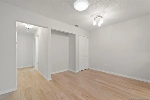 an empty room with wooden floor