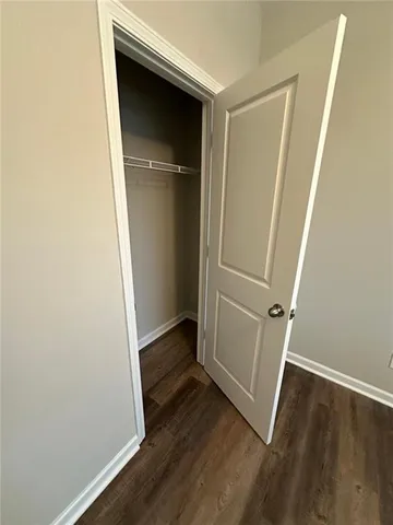 an empty room with wooden floor