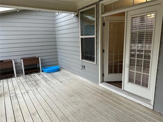 a view of a balcony with car parked