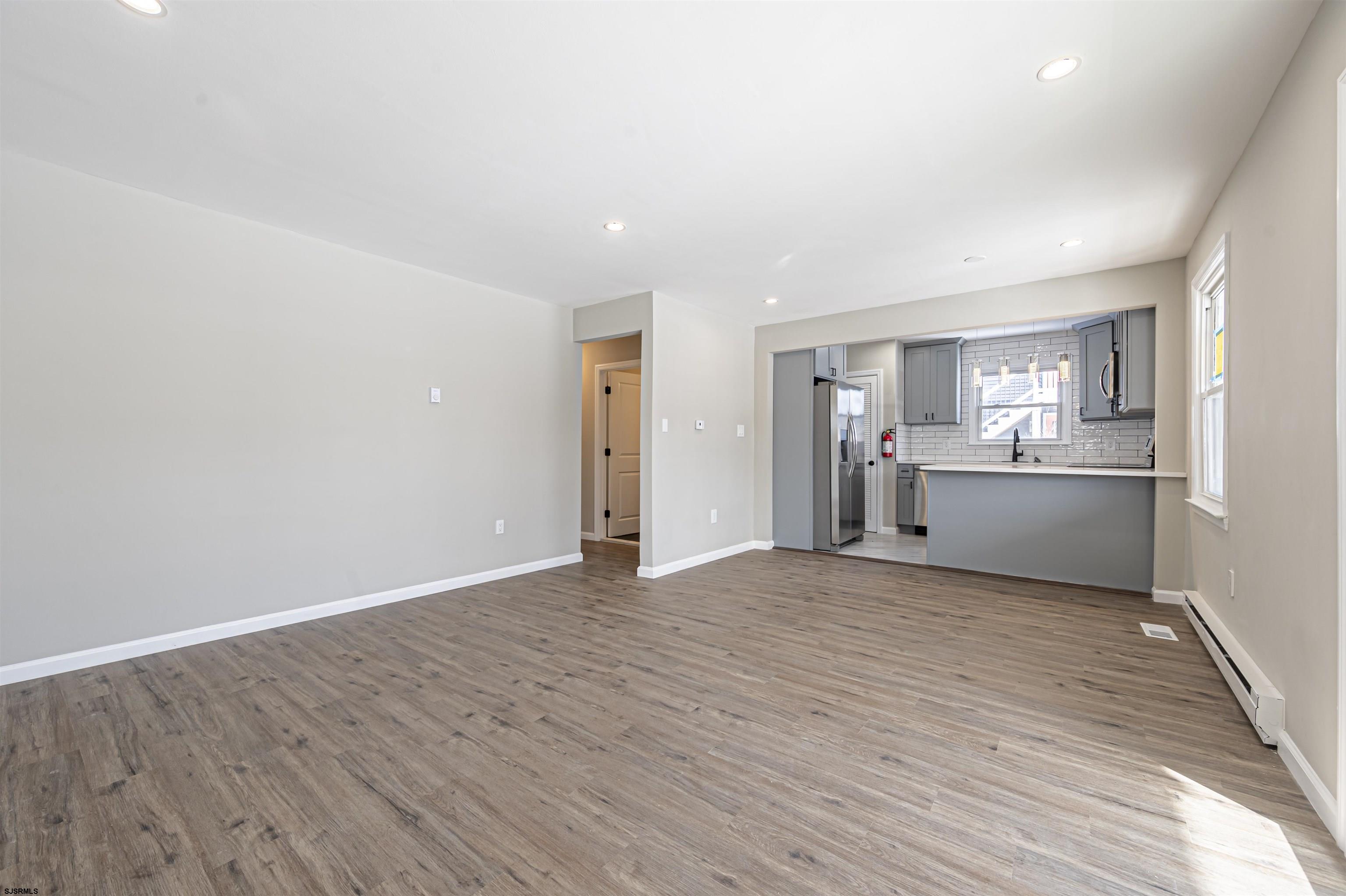4617 Schooner Road, Unit A Brigantine, NJ 08203 - Photo 16 of 31 a view of a kitchen with a sink and a refrigerator